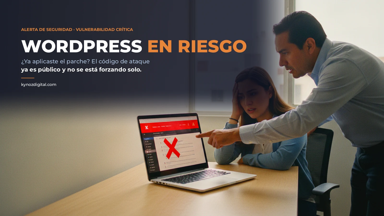 Two people in an office look with concern at their website dashboard, which shows a red security alert
